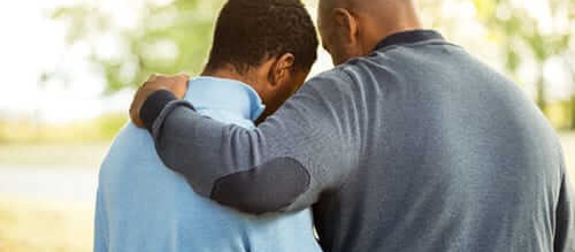 father and son participating in World Kindness Day Nov 13th